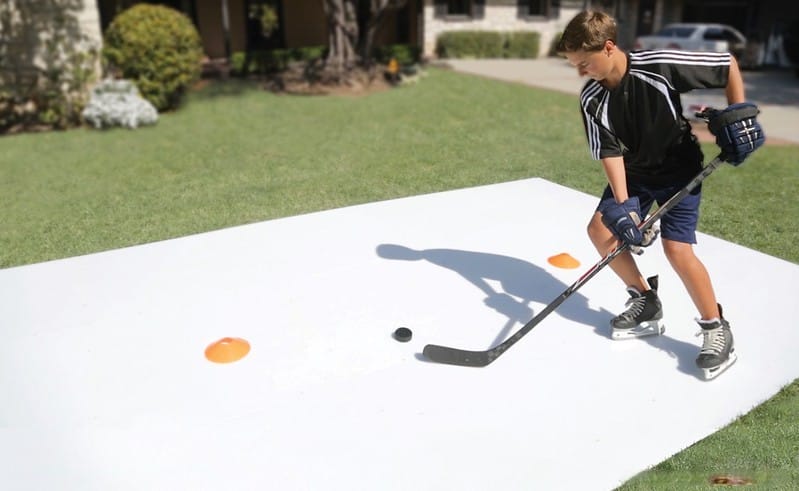 boy practicing on synthetic ice