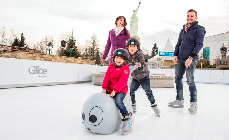 family ice skating together