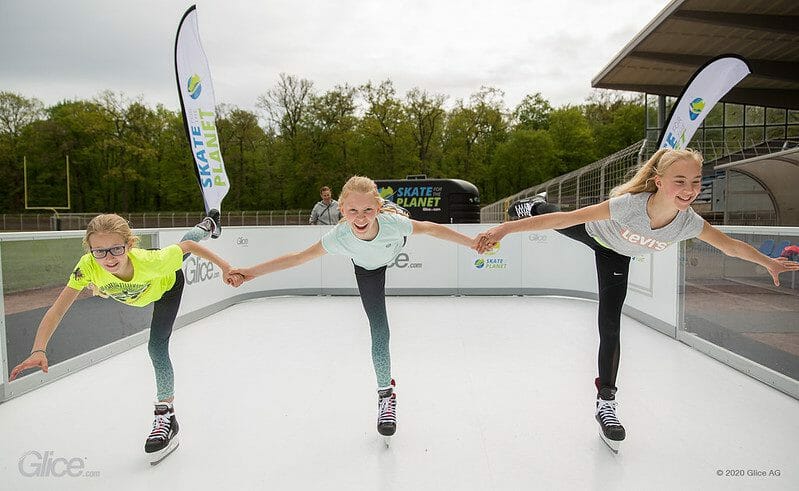 Figure skaters practicing on synthetic ice