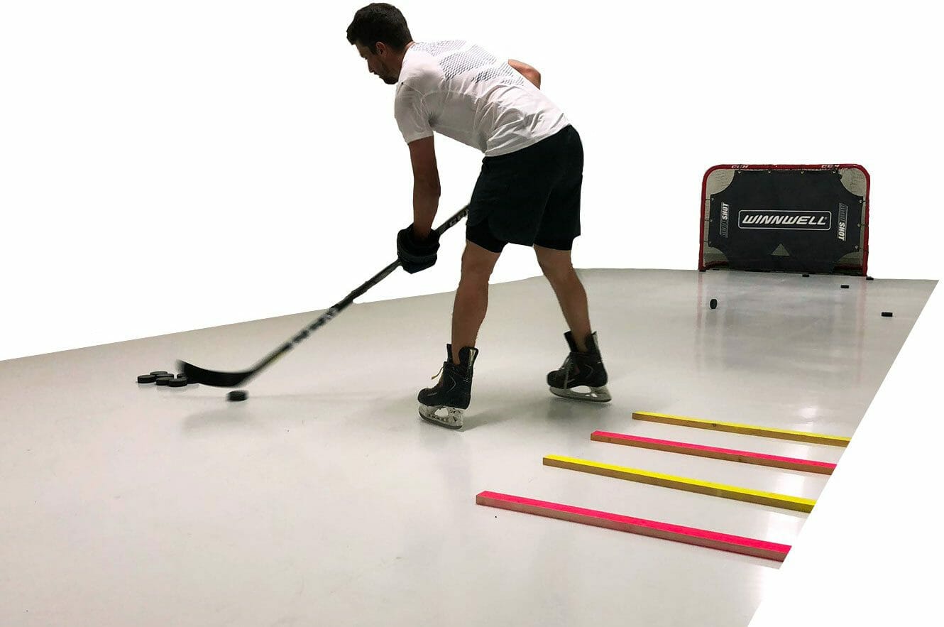 Man practicing hockey moves on Glice synthetic ice