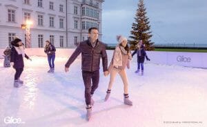 Couple ice skating together