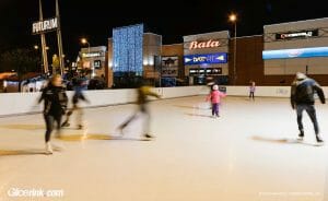 People ice skating on synthetic ice