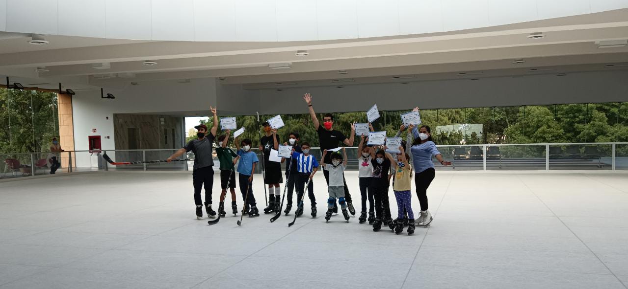 kids with their ice skating certificates