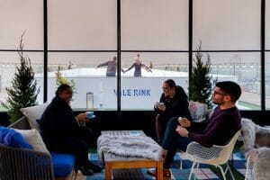 People enjoying drinks next to the Vale Rink