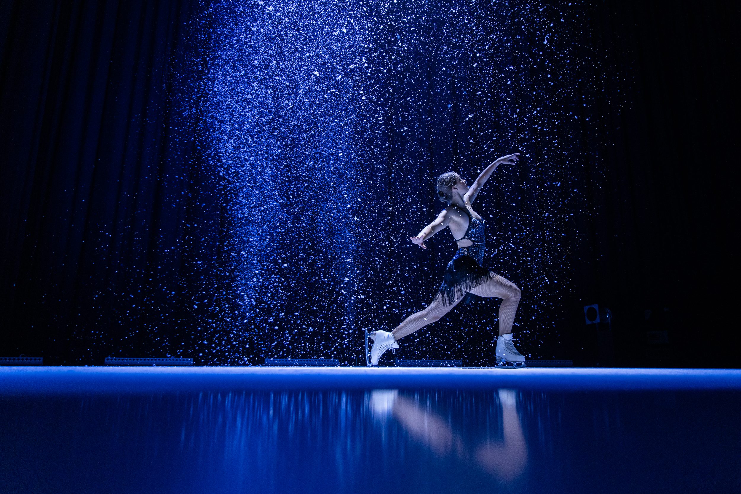 woman figure skating on synthetic ice